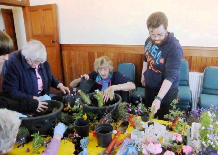 Filling hanging baskets - Shopper-Aide with SKDT Volunteers